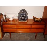 A teak Austin Suite sideboard fitted six drawers,