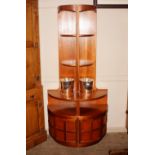 A pair of Nathan teak corner cupboards