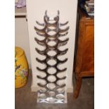 A large chrome wine rack, 100cm high