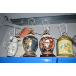 Three oriental decorated table lamps, and one othe