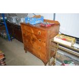 A walnut veneered chest fitted four long drawers