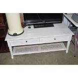 A white painted two tier coffee table, fitted 2 dr