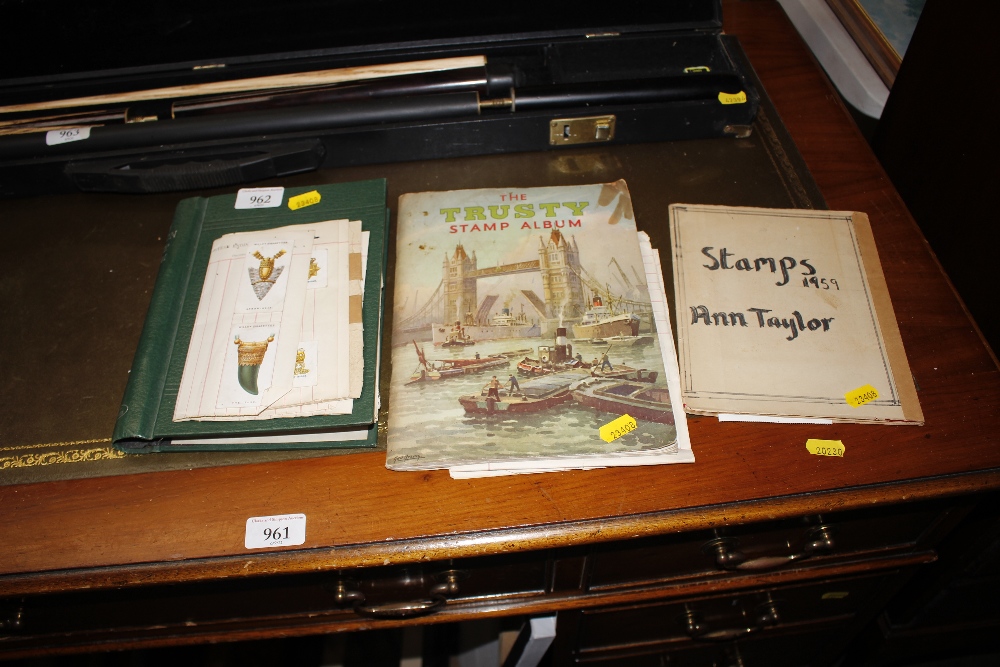 Three stamp albums and a collection of Wills cigar