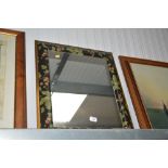 A floral decorated wall mirror