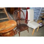 An Ercol stick back arm chair