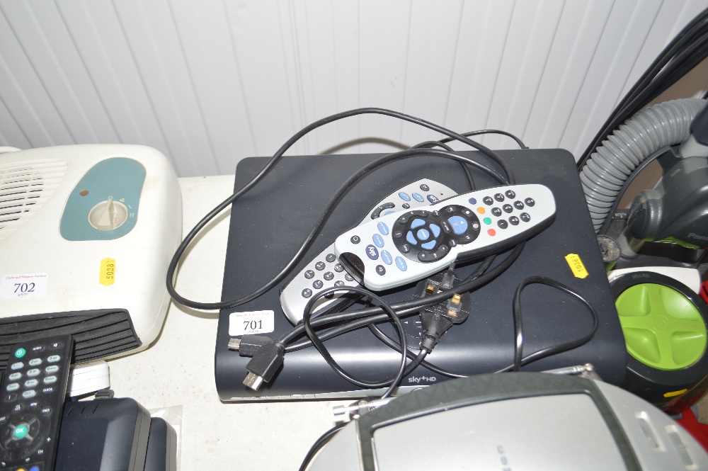 A Sky HD Box and two remote controls