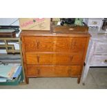 An oak chest fitted three long drawers