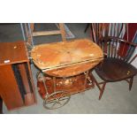 An inlaid decorated drop leaf tea trolley