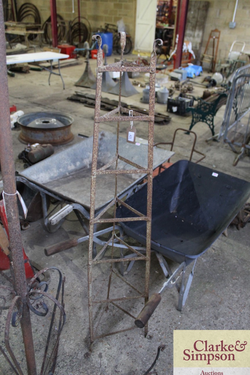 A wrought metal vintage saucepan stand