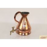 A vintage copper gallon jug with attached brass ta