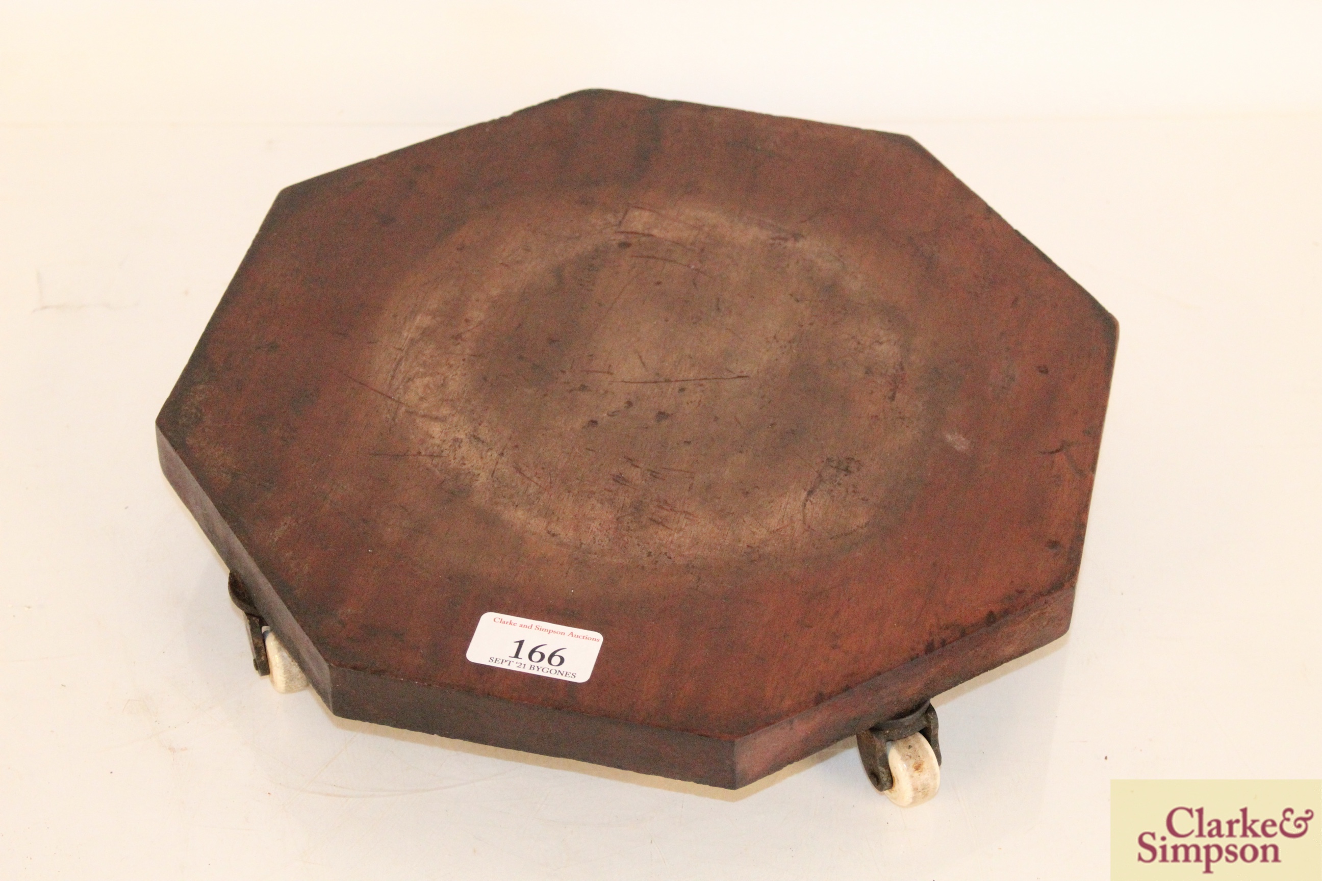 An early 19th Century octagonal cheese coaster on f