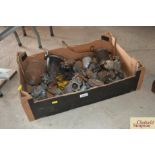 A box containing various carburettors, fuel lift p