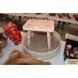 A vintage rustic pine stool and a garden sieve