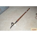 A Brades & Co. long handled daisy drawerer