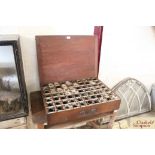 A teak box containing numerous phonograph cylinder