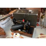 A Singer sewing machine in case, model 99K