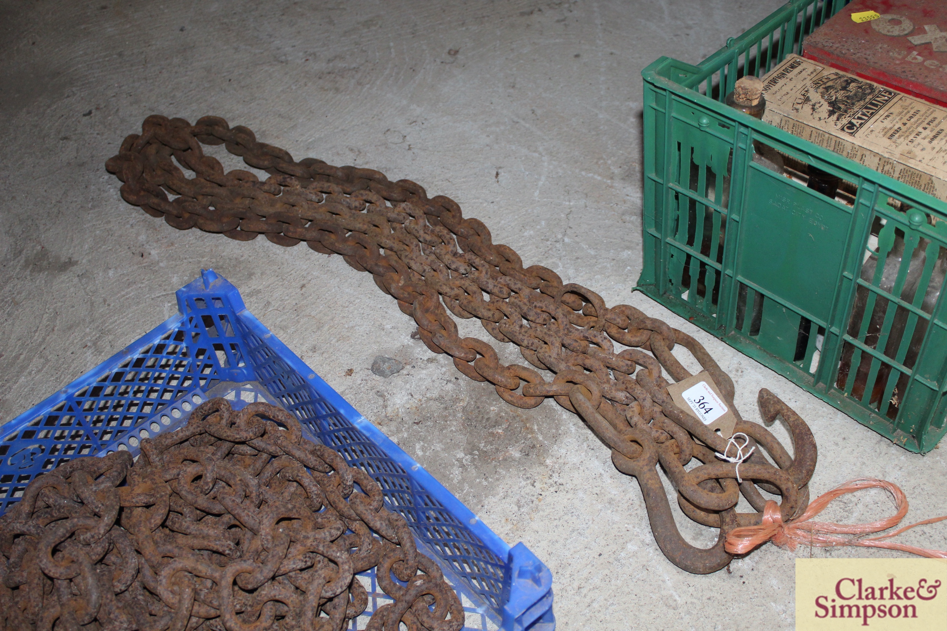 A pair of heavy hooked haulage chains