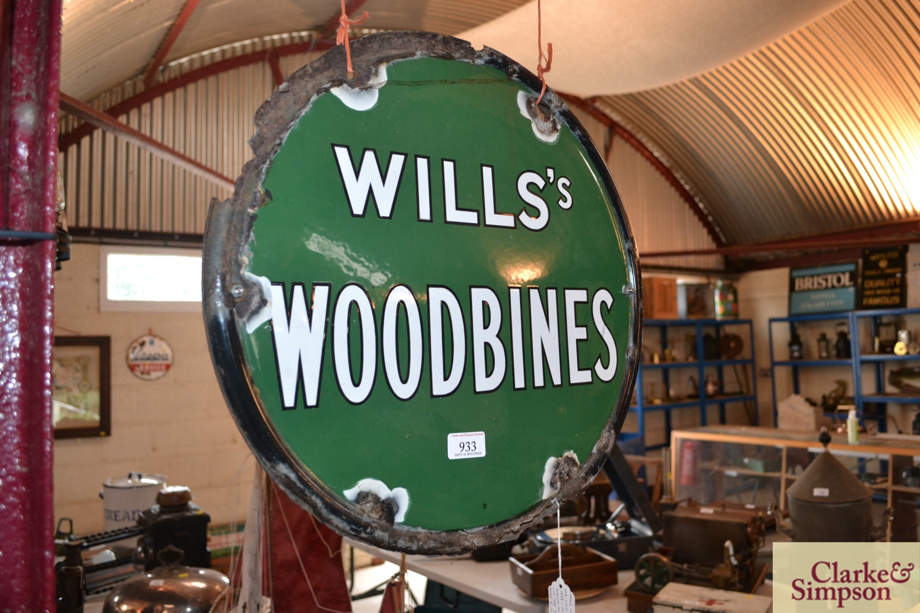 A circular double sided enamel advertising sign fo