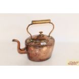 A large antique copper kettle