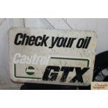 A Castrol GTX "Check Your Oil" advertising sign, a