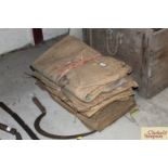 A bundle of coomb sacks and a bundle of hessian s