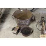 A cast iron bushel hod, a cast iron boiling pan a