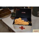 A vintage First Aid box and contents