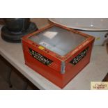 A Weston's half size biscuit tin with hinged glass