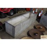 A large galvanised trough approx. 8' long x 3' dee
