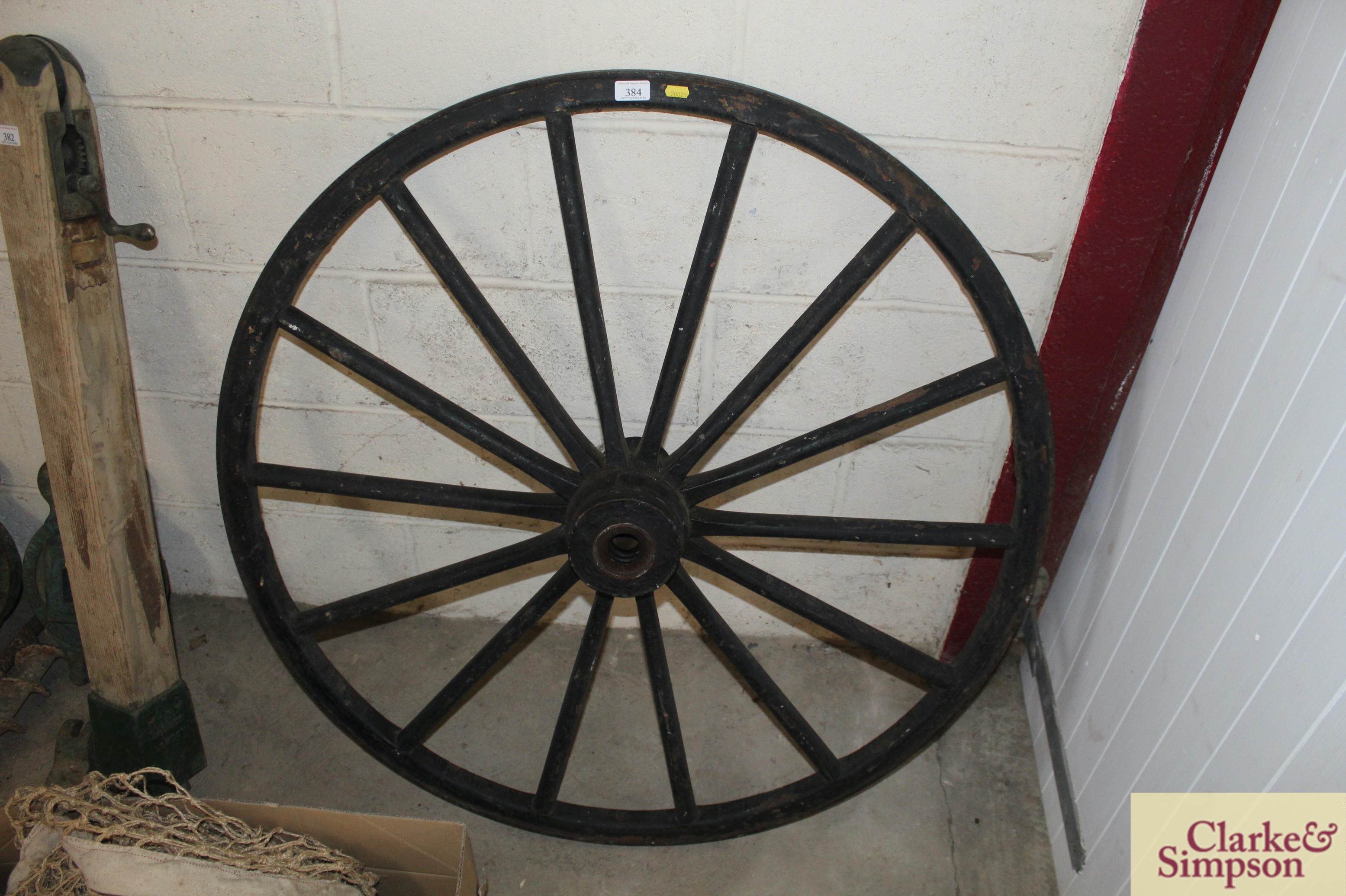 A vintage carriage wheel approx. 42" dia.