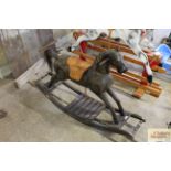 A rocking horse with leather saddle AF