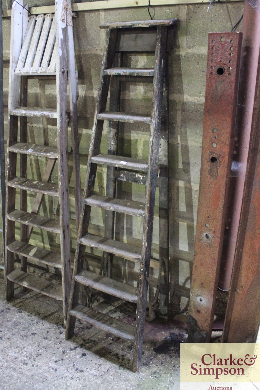 A set of tall vintage wooden steps with carved nam