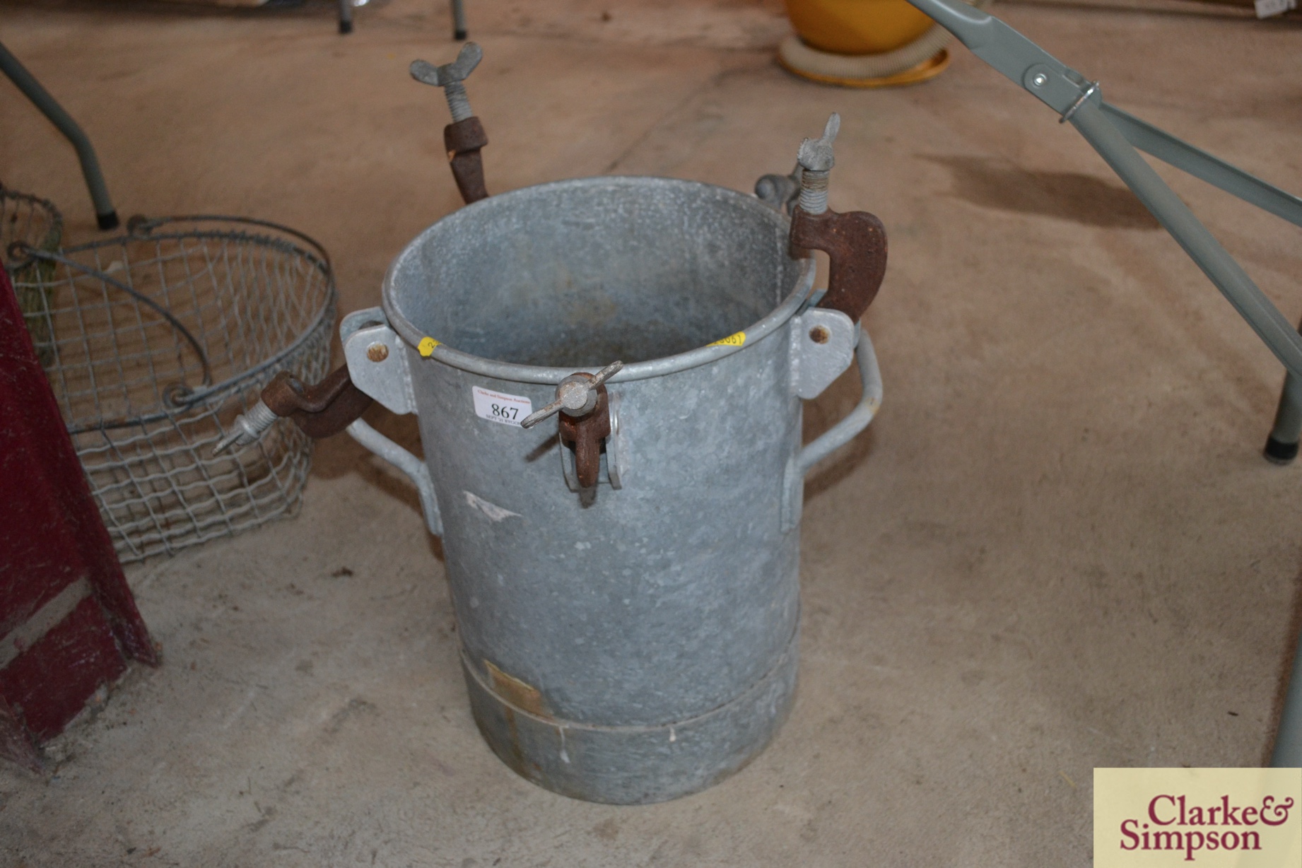 A galvanised pail with screw attachments