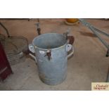 A galvanised pail with screw attachments