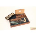 A mahogany folding case and various dentistry tool