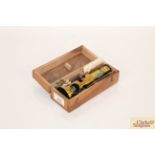 A small brass medical slide viewer in fitted wooden case, with brass slide handling tool