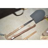 A wooden handled spade
