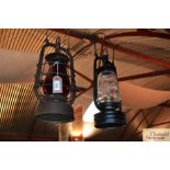 Two vintage Hurricane lamps, one clear glass and o