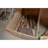 A box of various butchers cleavers, sharpening ste