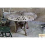 A rustic wooden wagon wheel table