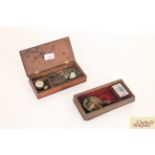 Two sets of mahogany cased travelling scales and s