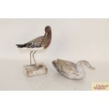 A wooden model of a curlew and a decoy duck