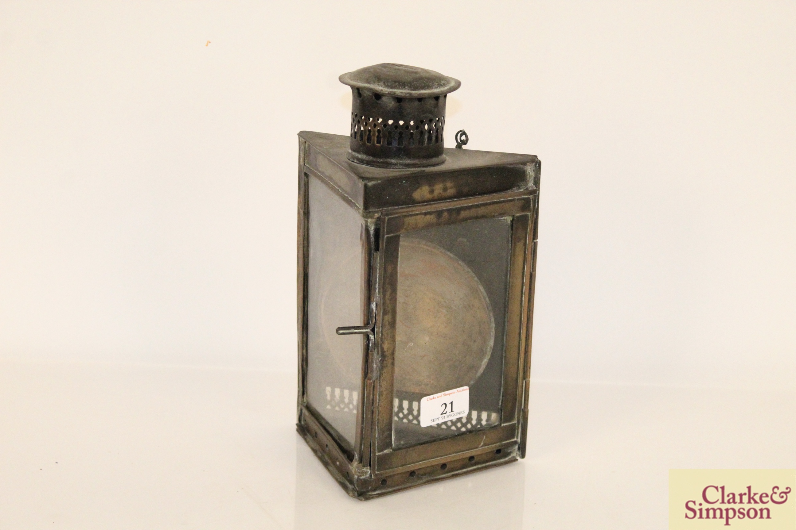 A vintage brass corner lamp