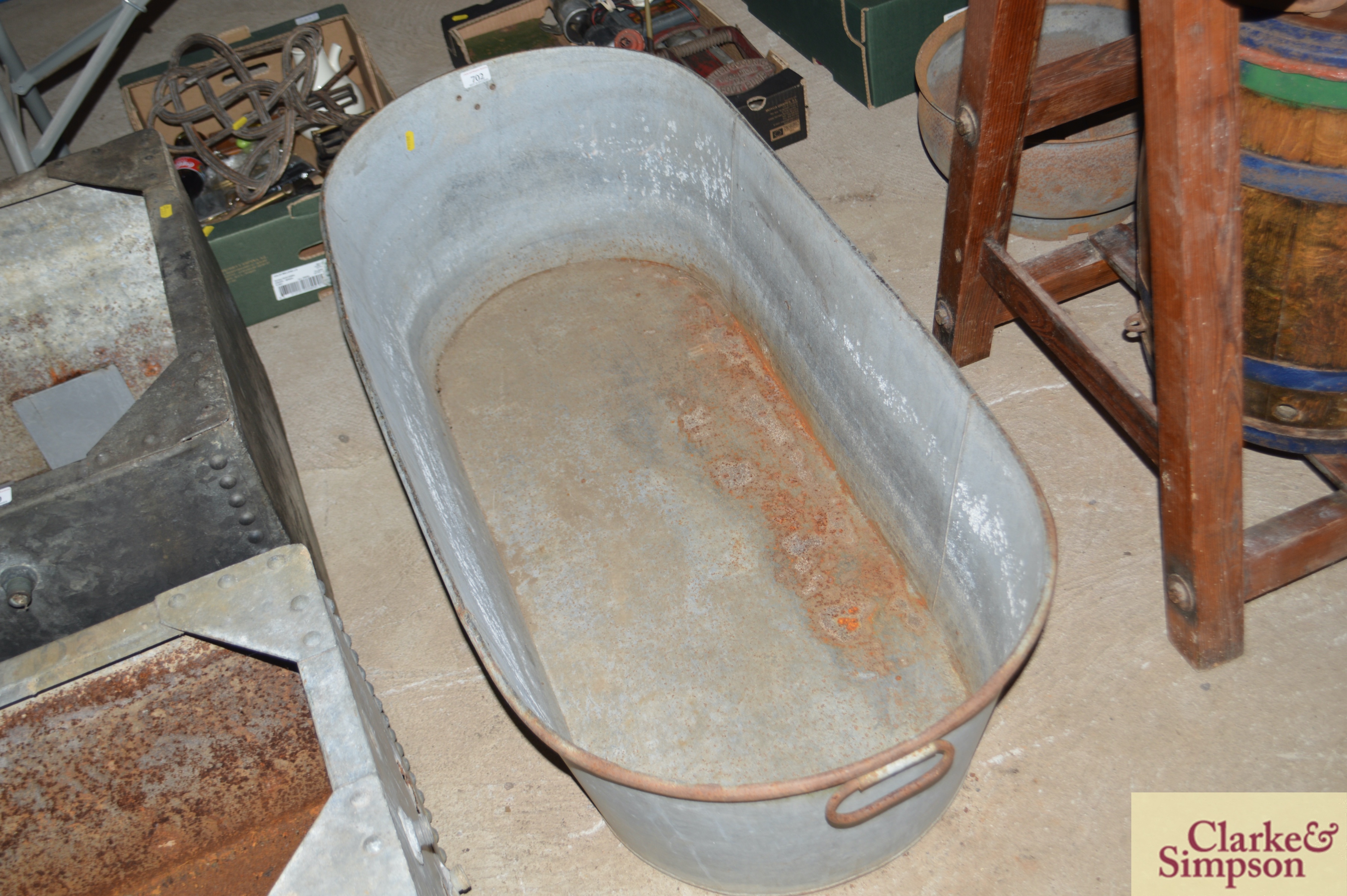 A vintage galvanised twin handled bath