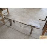 A rustic wooden pig stretcher