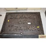 A cast iron sign "Beware of Trains approx. 22" x 15"