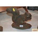 A cast iron door stop in the form of a squirrel