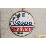 A circular enamel advertising sign for "Vespa" approx. 11"