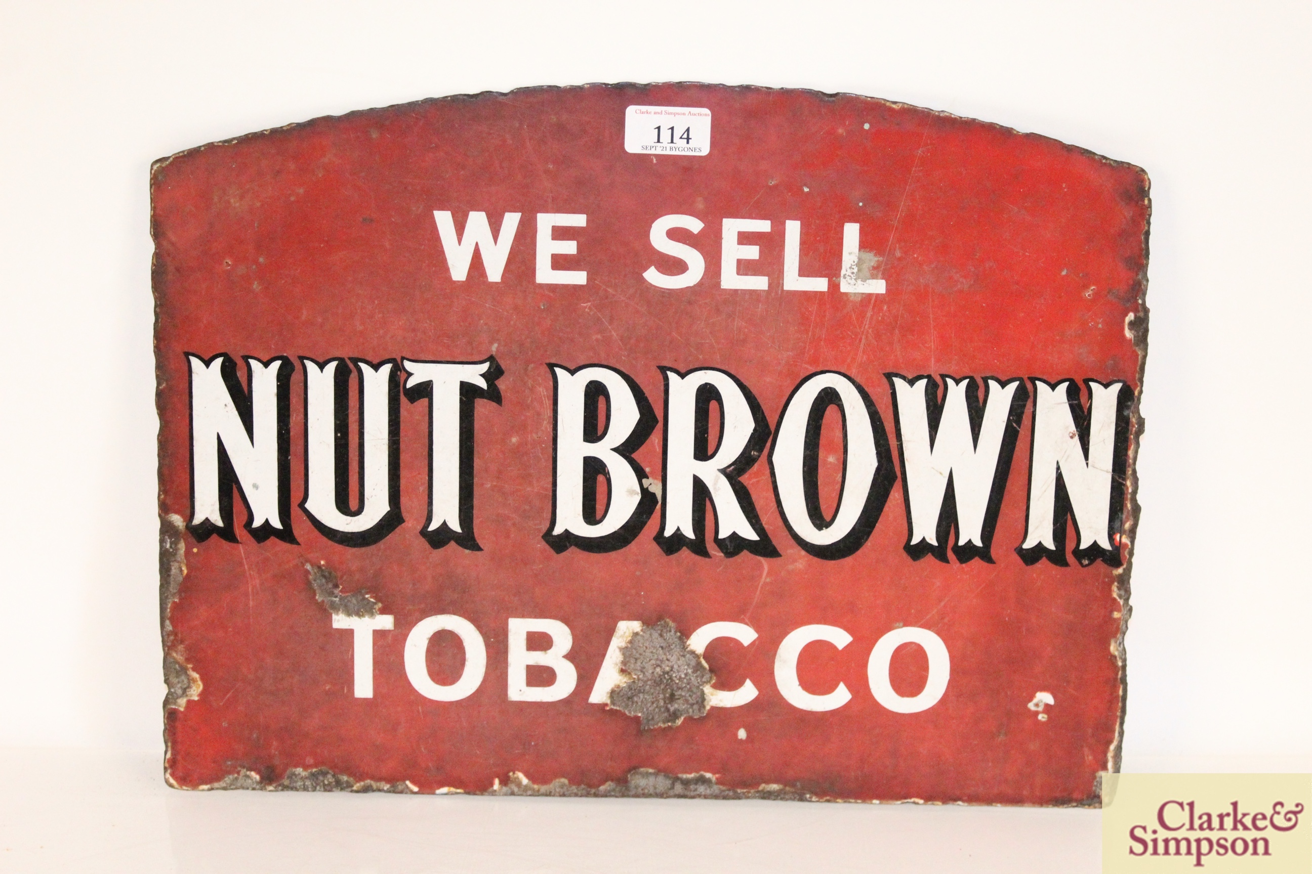 A double sided enamel sign for "Nut Brown Tobacco"