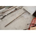 A vintage wooden hay rake